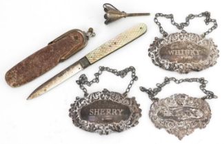 Victorian and later silver objects comprising three decanter labels, mother of pearl flanked folding