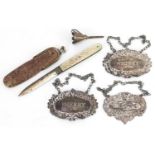 Victorian and later silver objects comprising three decanter labels, mother of pearl flanked folding