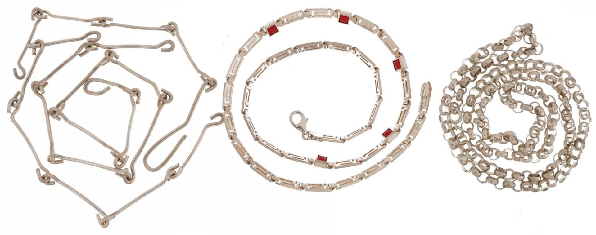 Two silver necklaces and a white metal necklace, one set with pink coral, the largest 60cm in - Image 2 of 3