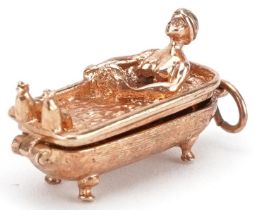 9ct gold opening charm in the form of a female in a Victorian bathtub, 2.5cm in length, 6.0g