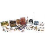 Sundry items including Guinness pin badges, caddy spoons and an alarm clock case