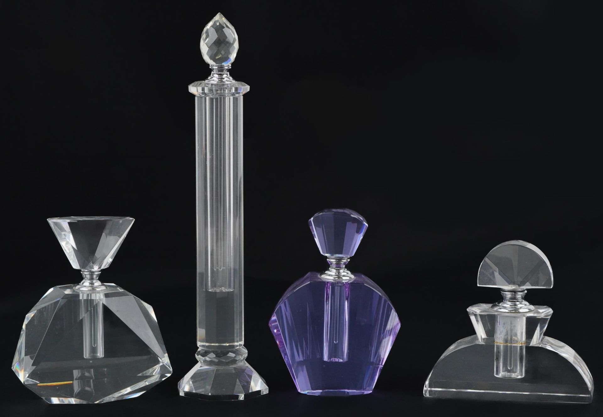Four Art Deco style glass scent bottles, the largest 26cm high
