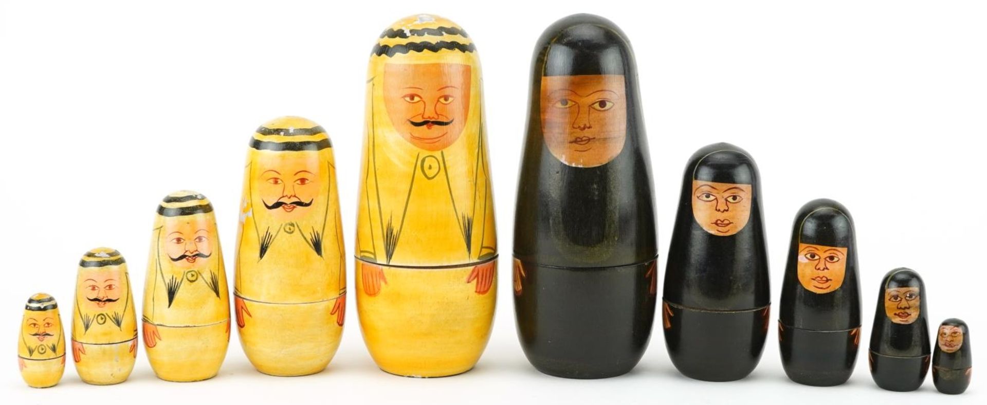 Two vintage Russian lacquered and hand painted wood Matryoshka stacking dolls, each 16cm high