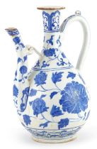 Turkish Ottoman Iznik ewer hand painted with stylised flowers amongst scrolling foliage, 25.5cm high