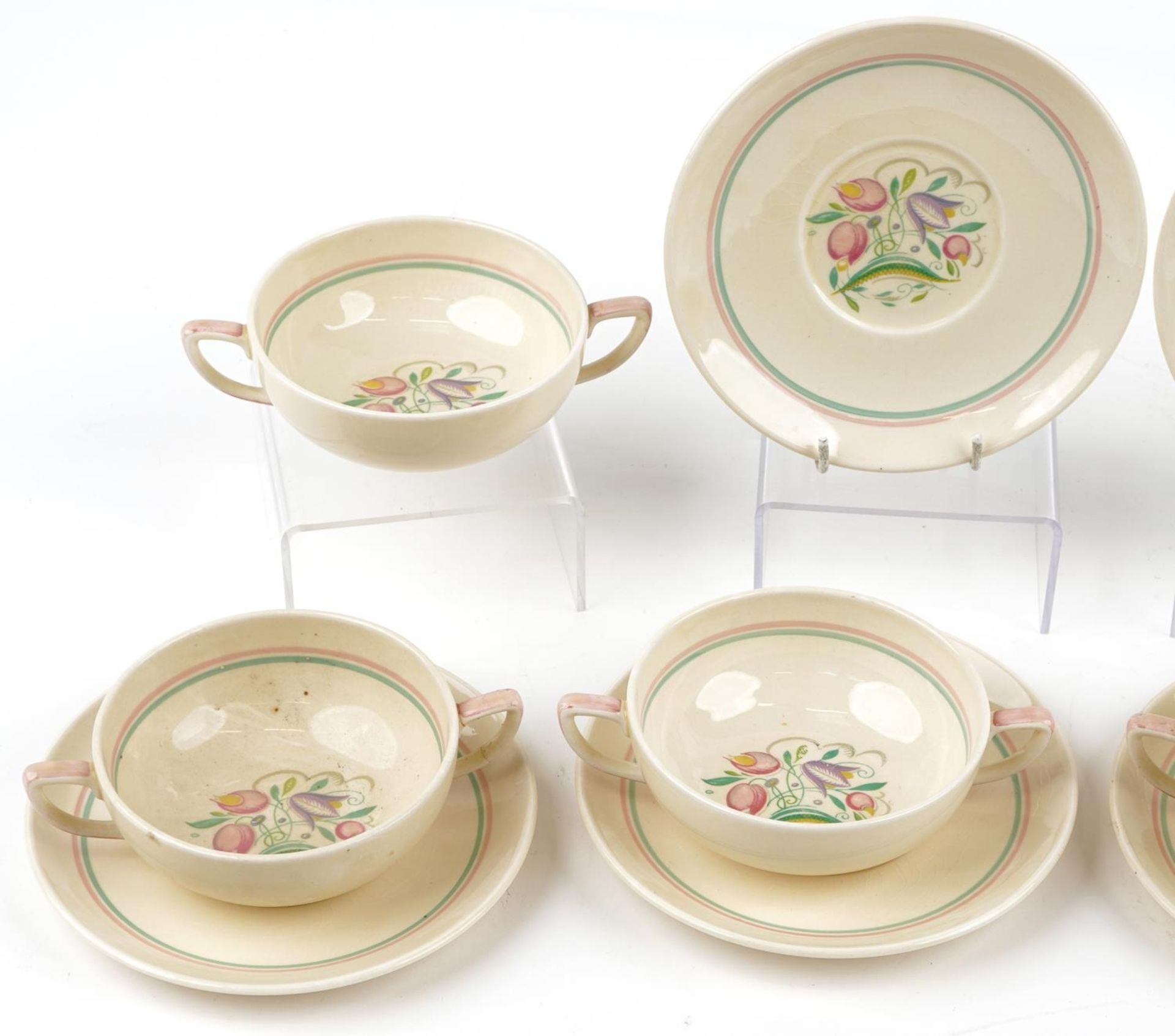 Set of six Susie Cooper twin handled soup bowls and saucers decorated with stylised flowers, each - Bild 2 aus 4