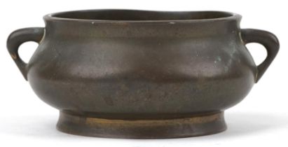 Chinese patinated bronze censer with twin handles, six figure character marks to the base, 12cm wide