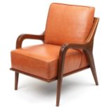 Scandinavian design hardwood lounge chair having a tan upholstered back and seat, 86cm H x 62.5cm