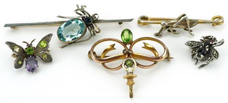 Five antique and later brooches set with assorted stones including an unmarked gold spider, silver