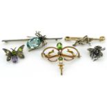 Five antique and later brooches set with assorted stones including an unmarked gold spider, silver