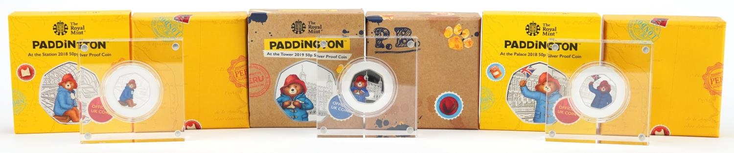Three Paddington Bear silver proof fifty pence pieces by The Royal Mint, housed in Perspex slabs