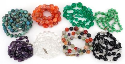 Eight crystal and semi precious stone necklaces including amethyst, carnelian and jade, the