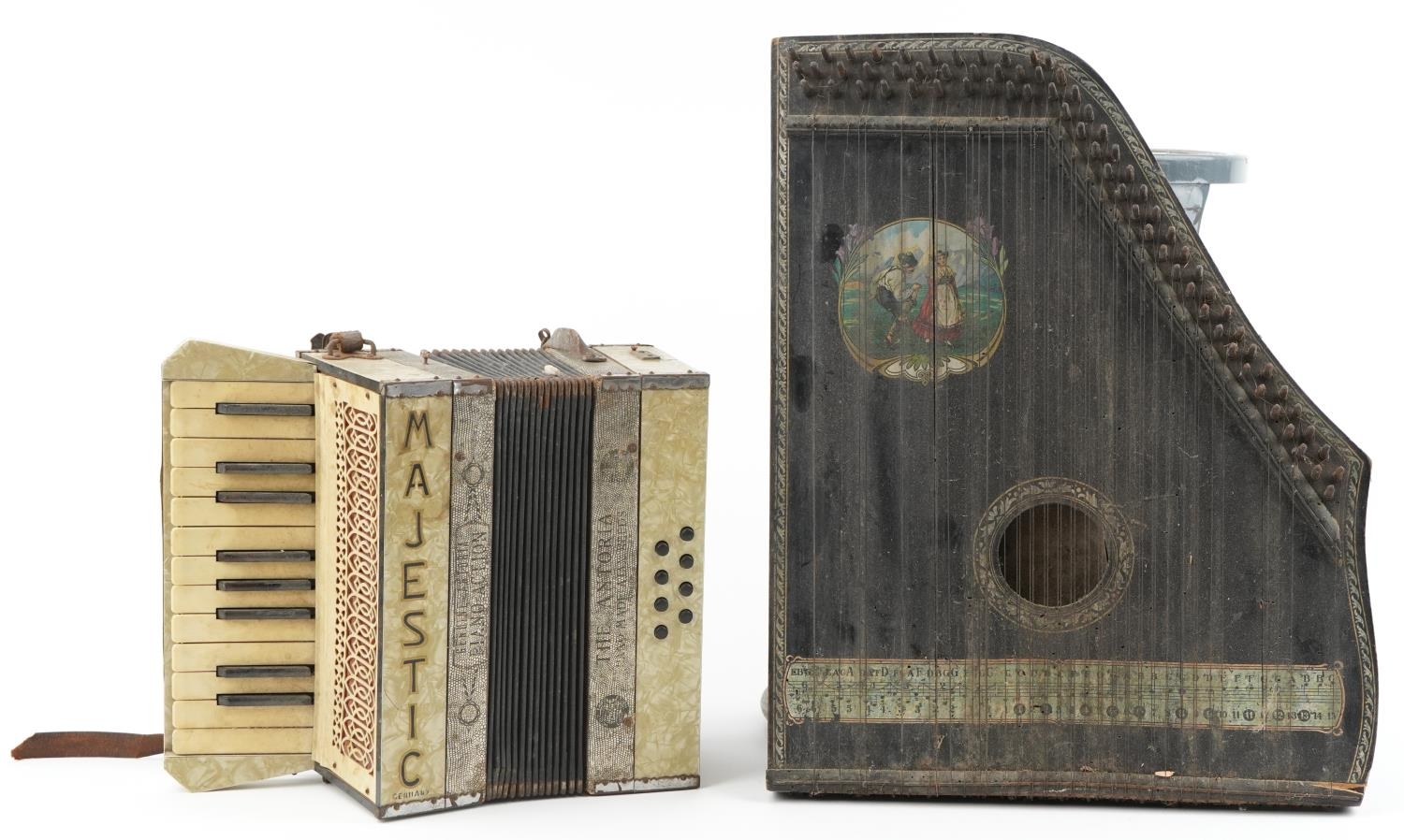 Two vintage German musical instruments comprising a Majestic accordion and ebonised zither