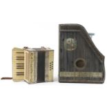 Two vintage German musical instruments comprising a Majestic accordion and ebonised zither