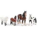 Four Beswick collectable horses including Clydesdale, Appaloosa, pinto pony and Piebald pinto