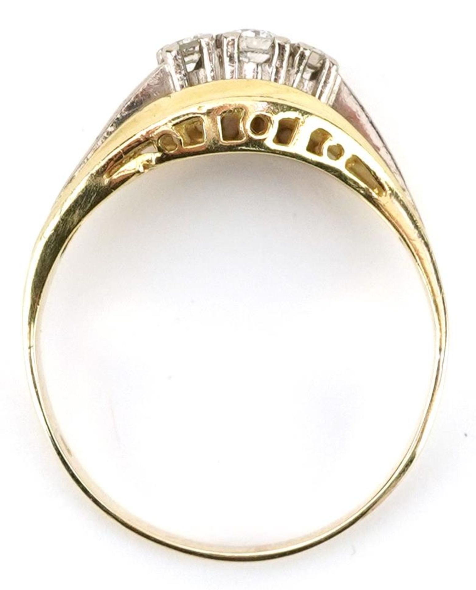 Two tone gold diamond three stone ring, indistinct mark to the band, the central diamond - Image 3 of 4