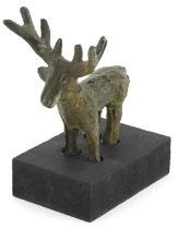 Middle Eastern Luristan type bronze of a deer raised on a rectangular black painted wooden base,