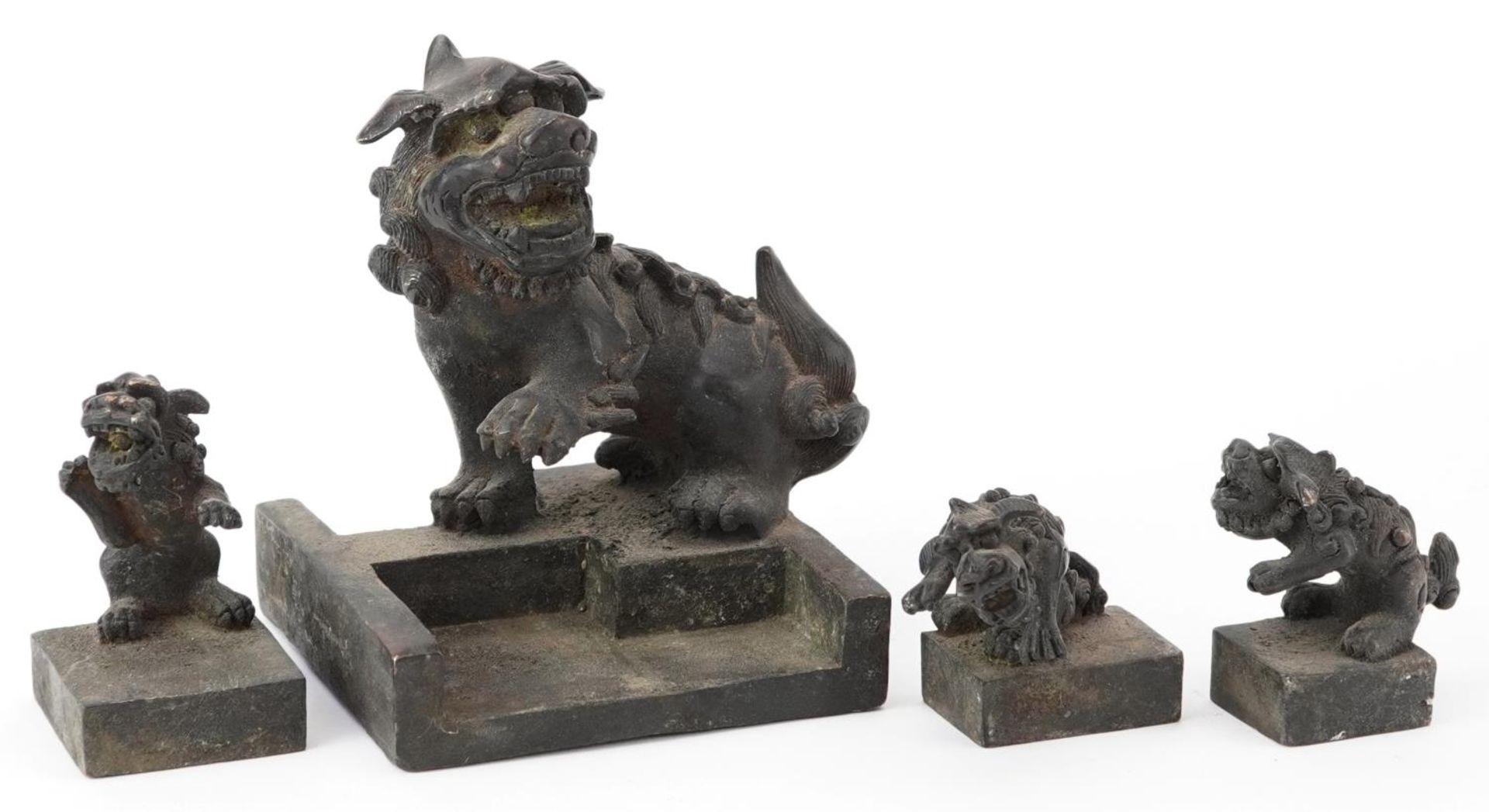 Set of four Chinese patinated bronze interlocking desk seals in the form of qilins, 12cm high - Image 6 of 8