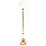 Venetian style gilt brass and white marble standard lamp surmounted with three Putti having a