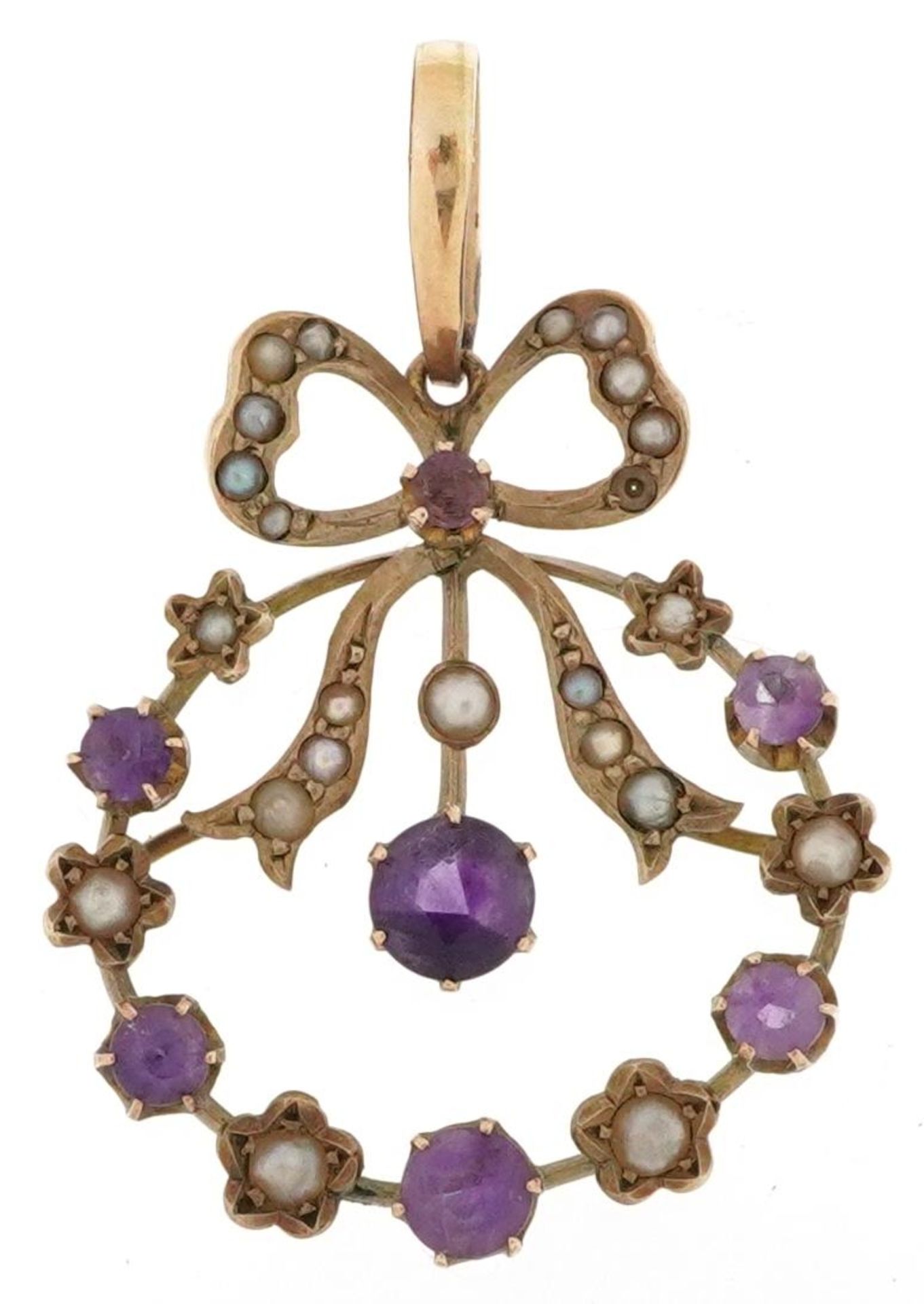 Edwardian unmarked gold amethyst and seed pearl openwork bow design pendant, tests as 9ct gold, with