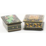 Two Islamic black lacquered boxes and covers including an example hand painted with flowers, the