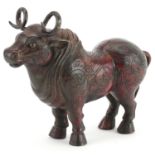 Chinese partially gilt and red lacquered bronze mythical animal, 22.5cm in length