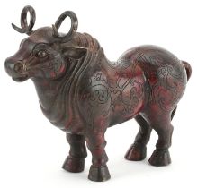 Chinese partially gilt and red lacquered bronze mythical animal, 22.5cm in length