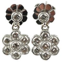 Pair of unmarked white gold diamond flower head drop earrings, each diamond approximately 2.20mm