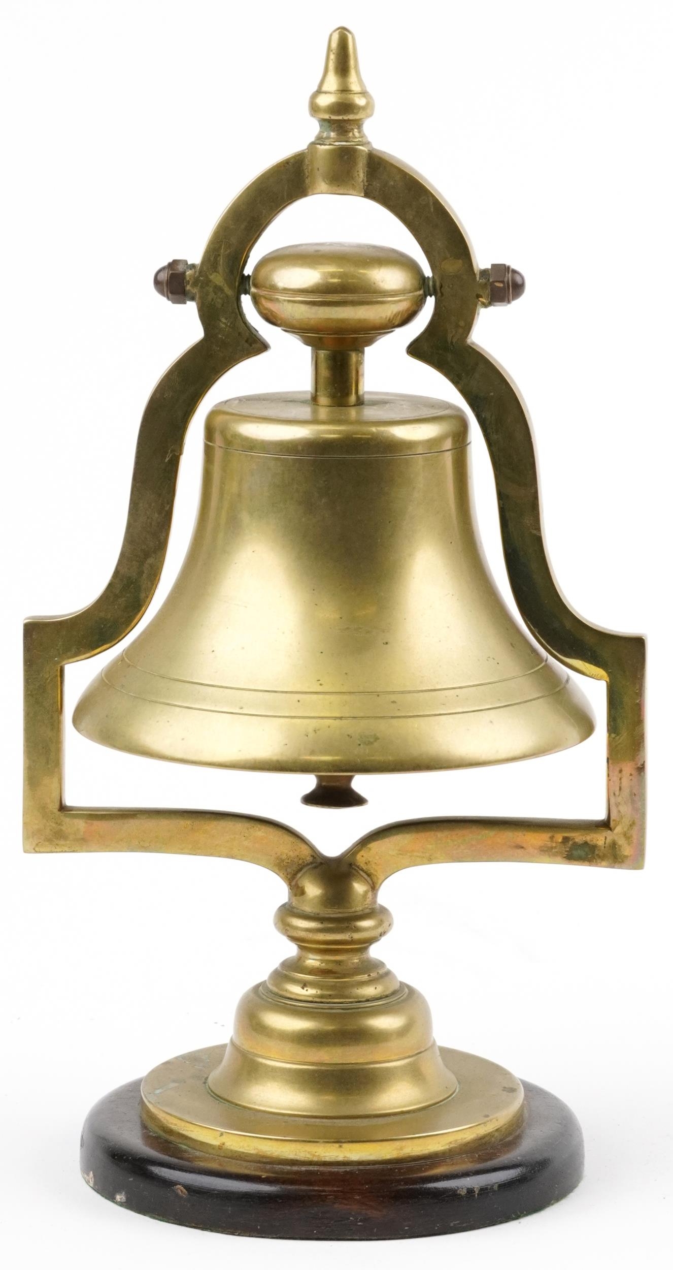 19th/20th century railwayana interest brass railroad bell raised on a circular mahogany base, 34cm