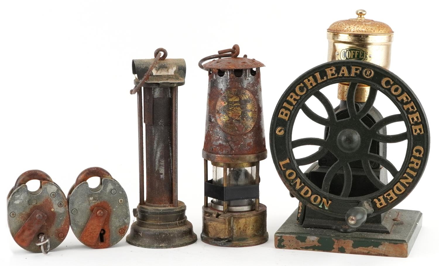 Two early 20th century miner's lamps and a Birchleaf coffee grinder, the largest 31cm high