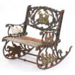 Child's painted cast iron rocking chair with wooden slats, cast with teddy bears and animals, 50cm