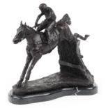 Patinated bronze statue of a jockey on horseback raised on a shaped black marble base, 35cm in