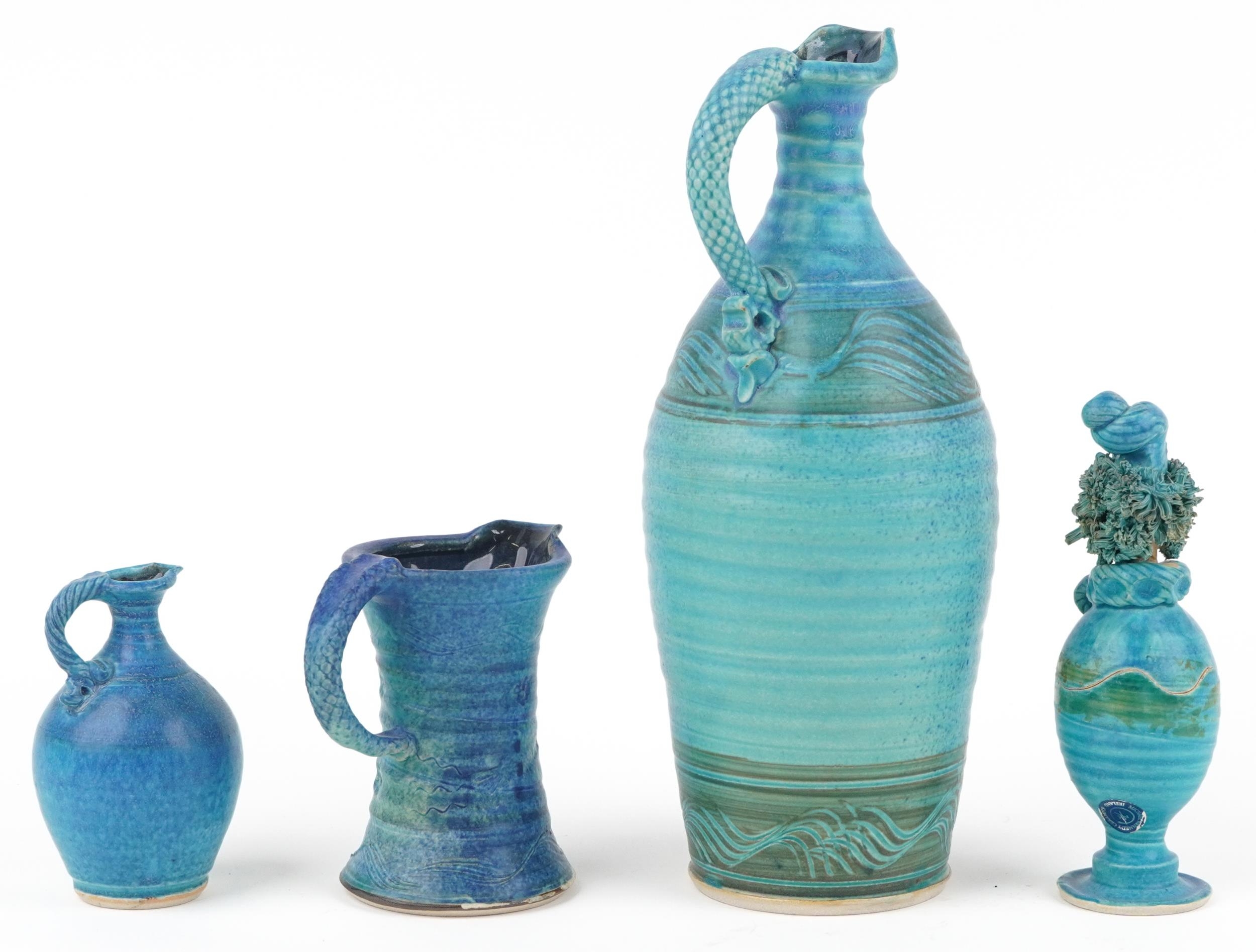 Michael Kennedy, Irish blue glazed studio pottery comprising three jugs and a figural pot and cover, - Image 2 of 4