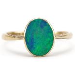 18ct gold opal ring with engraved setting, the opal approximately 9.60mm x 7.70mm x 3.0mm deep, size