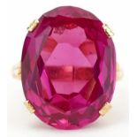 Chinese 22K gold ruby ring with openwork setting, character marks around the band, the ruby