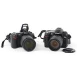 Two Nikon cameras with lenses comprising D 90 with Nikon DX AF-F Nikkor 18-105mm lens and D70 with