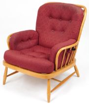 Ercol light elm Jubilee stick back armchair with red fleur de lis upholstered cushioned seats,