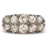 Antique unmarked gold diamond two row cluster ring, tests as 18ct gold, the largest diamonds