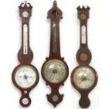 Three 19th century mahogany wall barometers with thermometers, one with enamelled plaque,