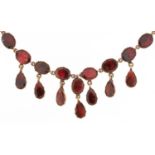 19th century rose gold oval garnet fringe necklace with closed foil backs, the clasp stamped 9KT,