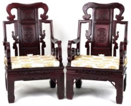 Pair of Chinese carved hardwood throne chairs with lift of cushioned seats, possibly Hongmu, each