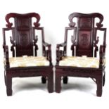 Pair of Chinese carved hardwood throne chairs with lift of cushioned seats, possibly Hongmu, each