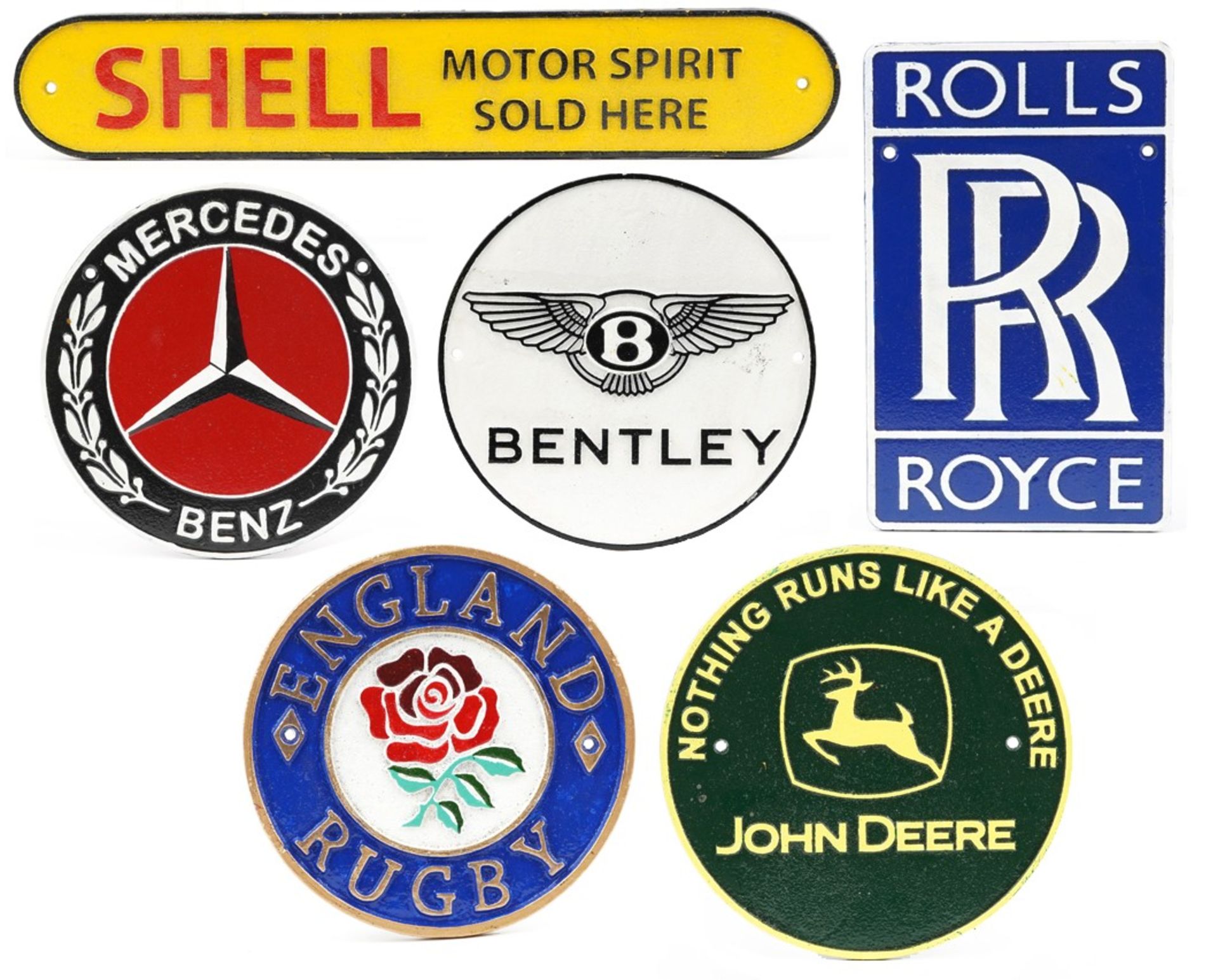 Six sporting and automobilia interest painted cast iron plaques including Rolls Royce and Shell