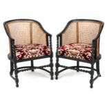Pair of Victorian ebonised barley twist bergère tub chairs with floral upholstered cushioned