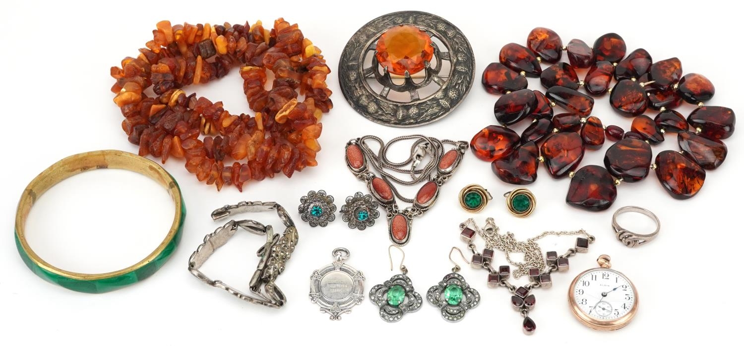 Antique and later jewellery, some silver including amber necklaces, antique style green and clear