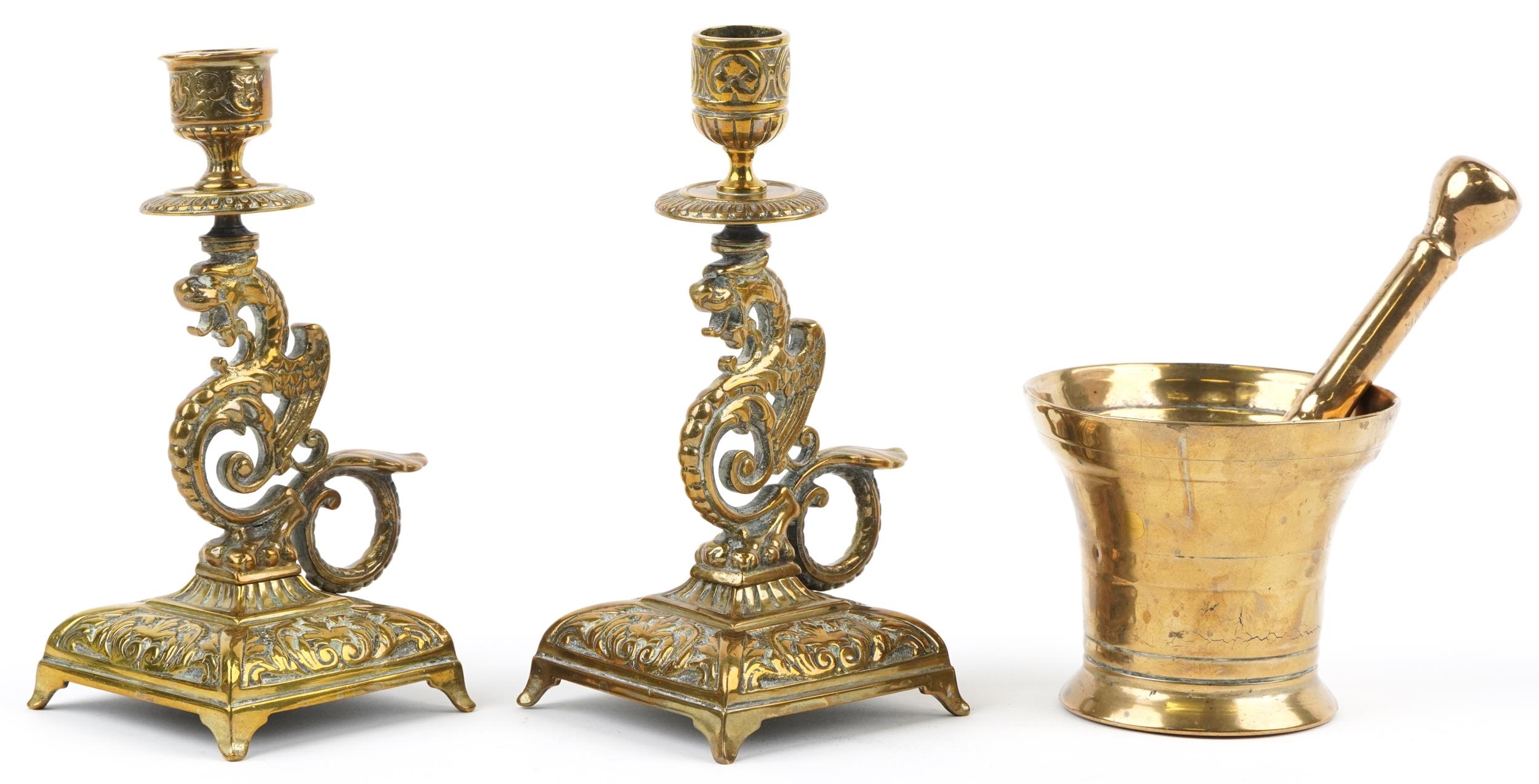 Antique bronze pestle & mortar and pair of dragon design candlesticks, the largest 19,5cm high
