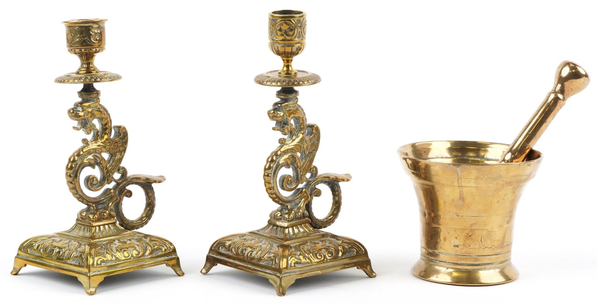 Antique bronze pestle & mortar and pair of dragon design candlesticks, the largest 19,5cm high