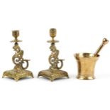 Antique bronze pestle & mortar and pair of dragon design candlesticks, the largest 19,5cm high