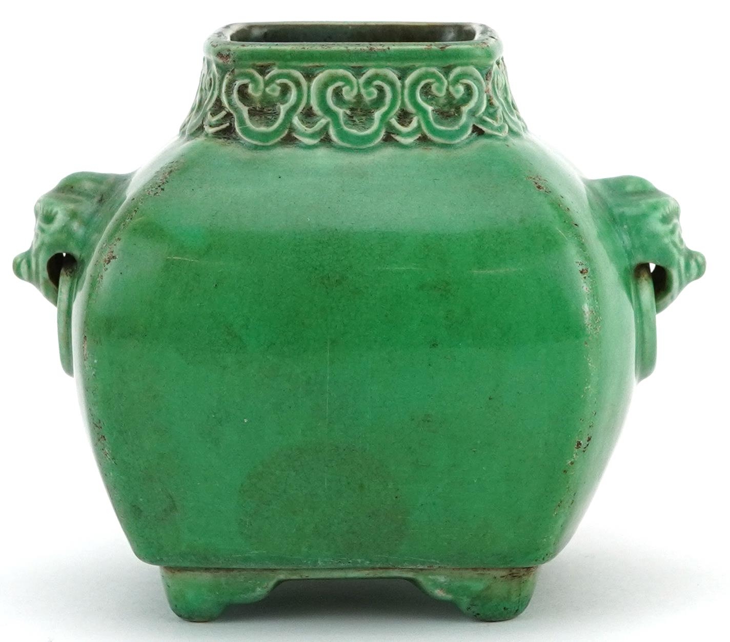 Chinese porcelain green glazed four footed vase with animalia ring turned handles and ruyi head