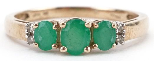 9ct gold emerald and diamond ring set with three emeralds and four diamonds, size N, 1.6g