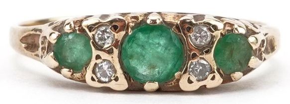 9ct gold emerald and diamond seven stone ring, the largest emerald approximately 4.10mm in diameter,